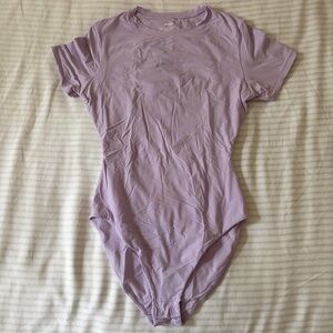 SKIMS Fits Everybody T-Shirt Bodysuit in Lily (Limited Edition Color)